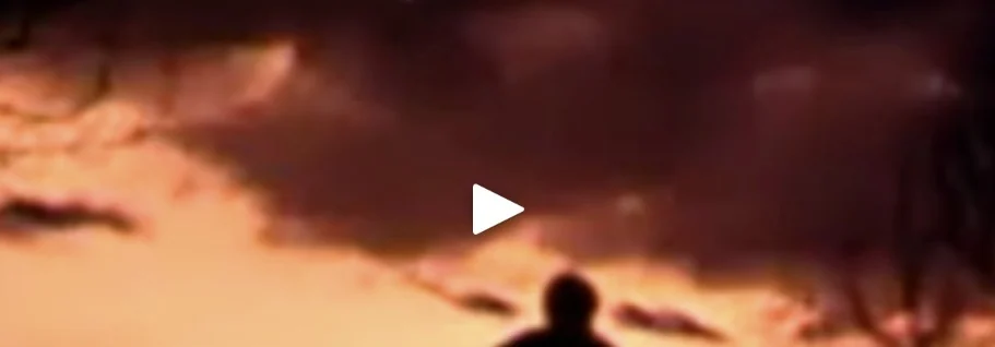 Still from Kristoball: a silhouette against a reddish sky
